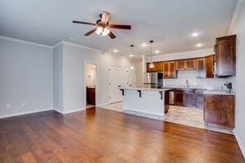 Spacious Kitchen Area & Living Room With Ceiling Fan